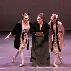 Stepmother and stepsisters reading the invite to the ball from the ballet Cinderella presented by Gulf Coast Ballet Theater.